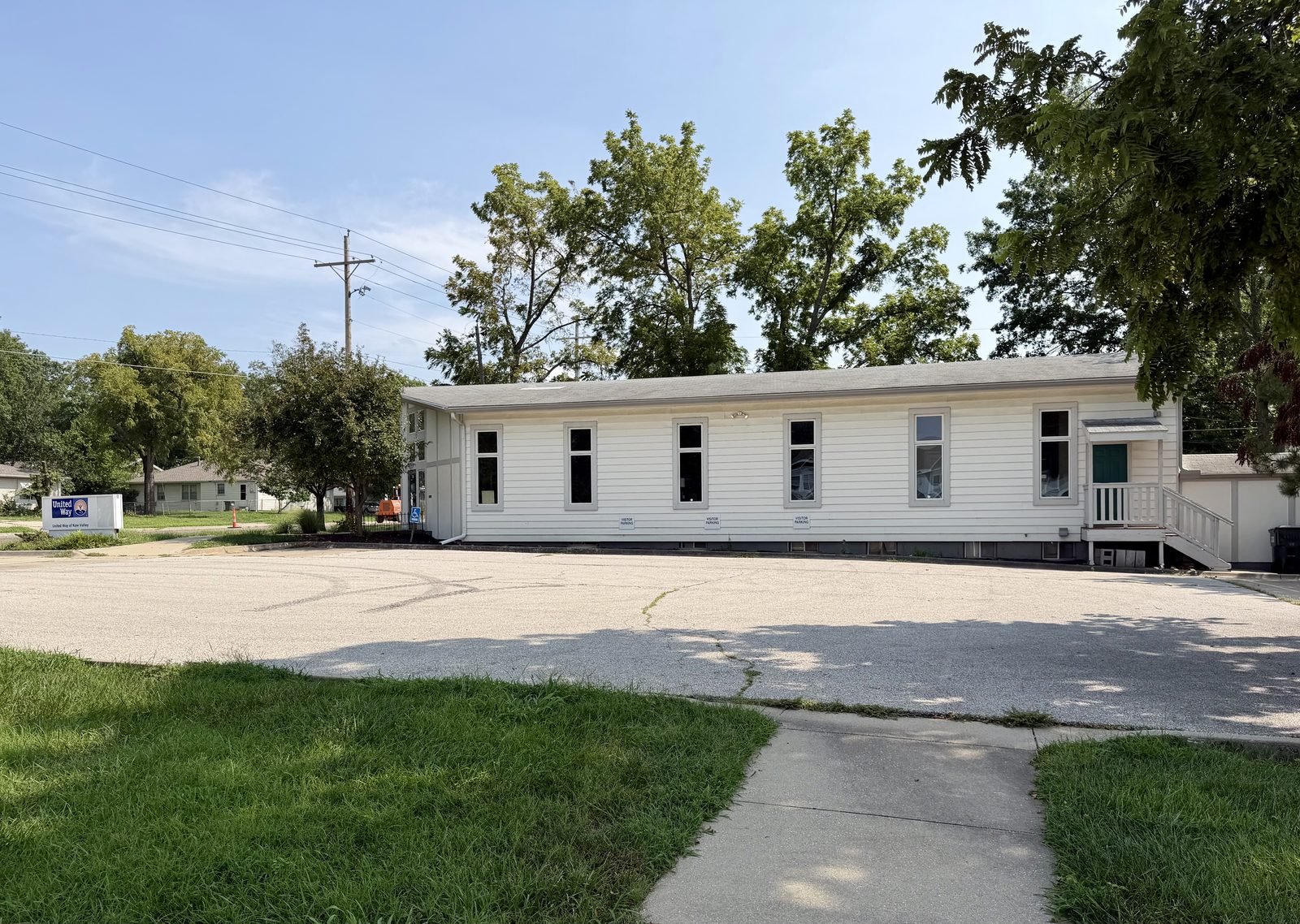 The United Way building at 1127 Iowa Street in Lawrence, Kansas, with visitor parking in front